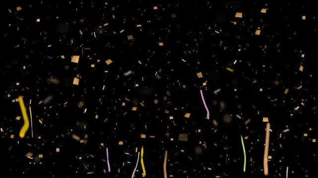 Colorful confetti and streamers falling against black background
