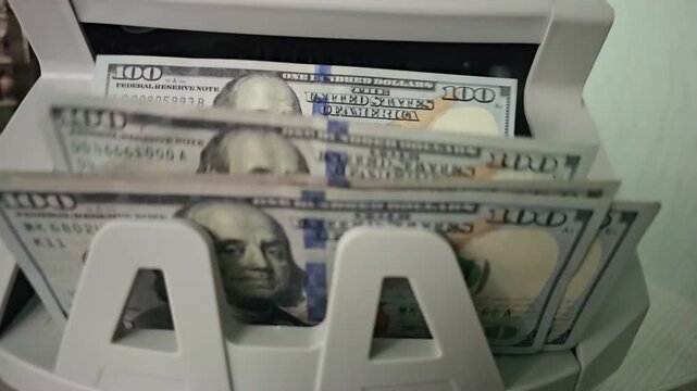 Counting cash using a money counter machine in a business setting