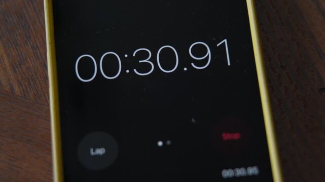 The stopwatch is running on the mobile phone screen