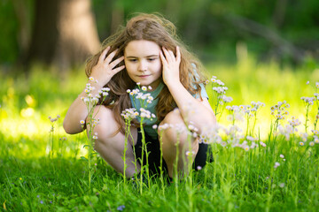 Fototapeta premium Dreamy sunlight creates warm childhood mood. Soft dreamy bokeh surrounds cute girl. Dreamy meadow scene feels relaxing. Dreamy portrait highlights positive emotion.