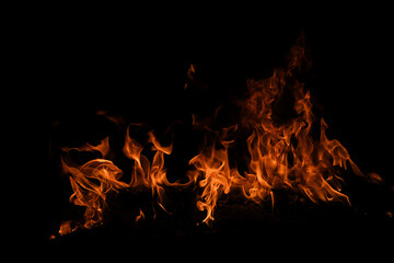 Fototapeta premium Fire blaze flames on black background. Fire burn flame isolated, abstract texture. Flaming explosion with burning effect. Fire wallpaper, abstract art pattern.