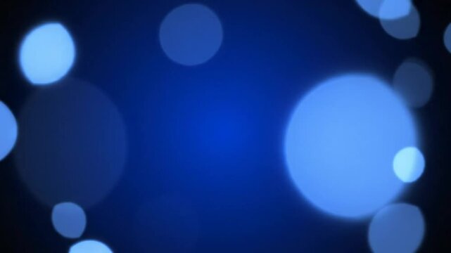 Abstract shimmering bokeh lights background with soft glow and subtle movement for festive decoration or holiday design
