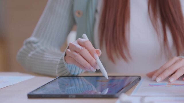 financial advisor or crypto trader holding digital tablet in hands consulting stock market investor analyzing trade charts dynamic indexes investing trends on tab screen. Business analyst