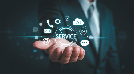 Fototapeta premium businessman holding glowing virtual customer service icon panel with communication symbols for technical support call center assistance and ai assistant technology