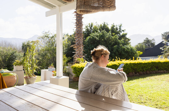 young woman using mobile phone outdoors