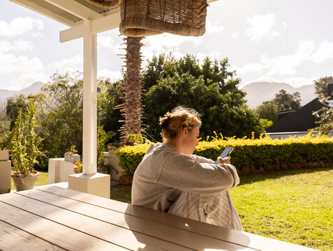 young woman using mobile phone outdoors