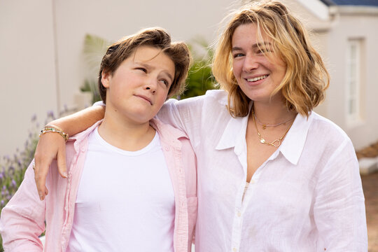 portrait of young woman and her younger brother