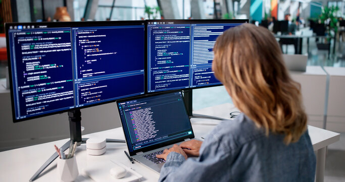 Woman Developer Writes Code On Laptop