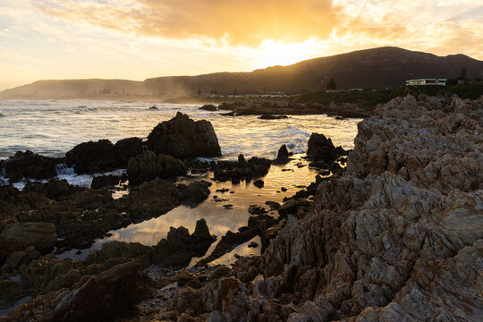 Sunset and dusk settling over beautiful Kammabaai Beach, Hermanus, South Africa