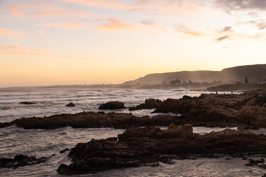 Sunset and dusk settling over beautiful Kammabaai Beach, Hermanus, South Africa