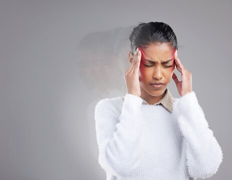 Woman Experiencing Headache, Stress, or Migraine with Hands on Temples.