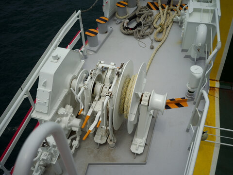Heavy industrial mooring winch on the ferry boat deck for maritime transportation