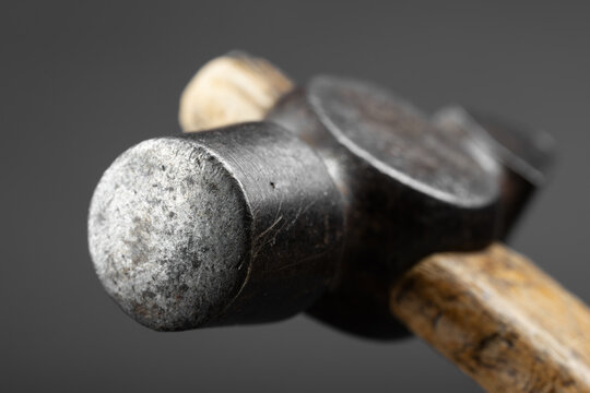 Close-up of an old metal ball-peen hammer head