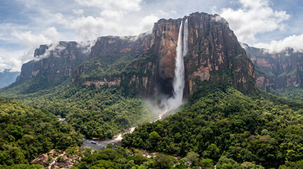 The world’s tallest waterfall plunging from a dramatic cliff into a lush rainforest below. Angel Falls in Venezuela  © pinan