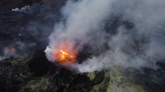Volcanic eruption with lava flow and smoke