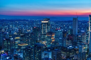 Obraz premium Beautiful night view of Yeouido financial district skyscrapers with bright office lights in Seoul, South Korea 