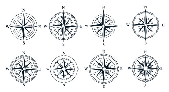 Collection of vintage compass rose designs with cardinal directions in black and white for maps and navigation themes.