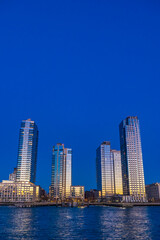 Obraz premium Modern Waterfront Skyscrapers in New York City at Blue Hour