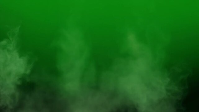 Green fog rises in a dark mysterious environment slowly