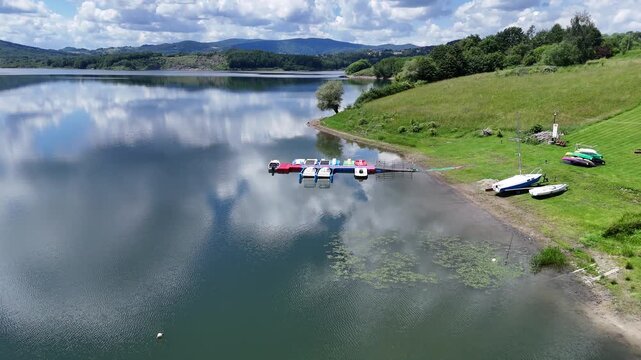 Aerial View of Mucharskie Lake Marina with Pedal Boats and Scenic Mountain Landscape, Poland