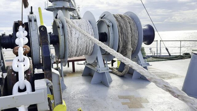 ropes on a ship. mooring winch rotate, rope passing and tight. preparation for mooring before the port.