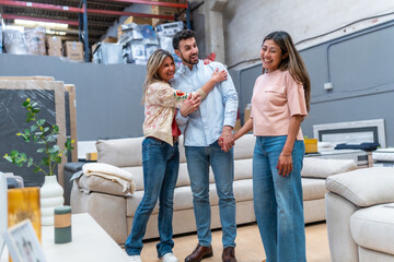 Obraz premium Family group shopping for new sofa in furniture store