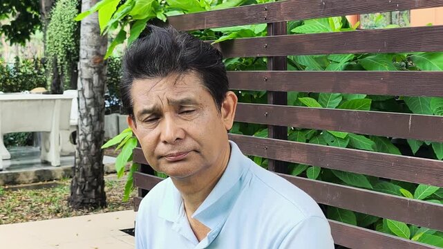 Tired, exhausted and sleepless Middle Aged Asian man with insomnia, concept image for Mental Stress, Sickness, frustration, depression, stress management for businessman or office worker, face closeup