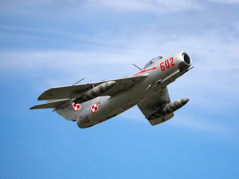MLADA BOLESLAV, CZECH REPUBLIC - JUNE 13, 2026: Historic Polish Lim-2 (MiG-15bis) jet fighter number 602 flying head-on directly overhead during the Historical AirShow against a cloudy sky.