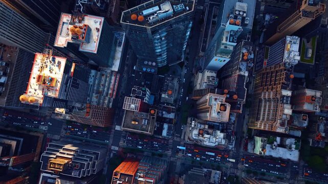 Descending in the neighborhood of Midtown Manhattan at daytime. Top view on the street with hectic traffic.