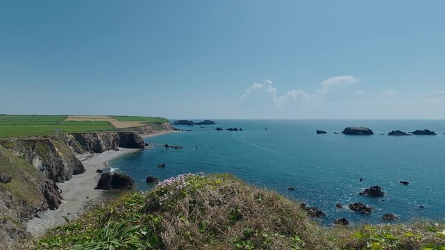 Epic seascapes shimmering calm seas blue skies cliffs and quiet beaches copper Coast Waterford Ireland epic locations