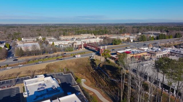The Peachtree Corners pedestrian bridge, The Forum Peachtree Corners shopping mall, Peachtree Parkway (SR 141) in Georgia, Establishing drone shot
