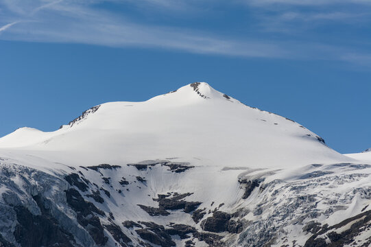 Dramatic Alpine Summit Under Clear Skies