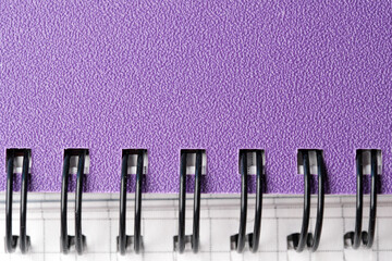 Creative workspace tools to inspire new ideas on a purple notebook © aviavlad