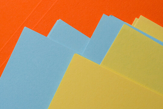 Vibrant layers of colorful paper in a creative space