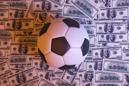 Soccer ball lying on scattered hundred dollar bills symbolizing betting, finance and modern sports economy with creative lighting. 3D Rendering