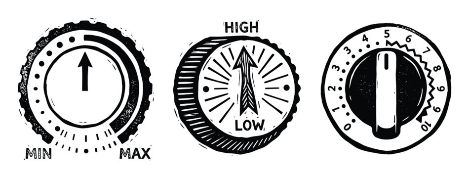 Black and white volume control knobs, three different round dials