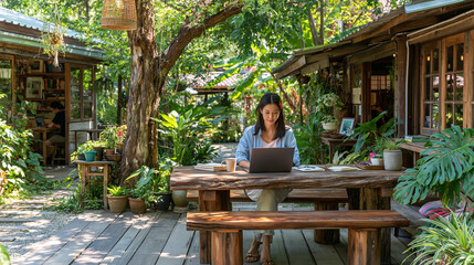 Fototapeta premium Achieve Work-Life Balance in a Serene Outdoor Home Office: Woman Working on Laptop in Lush Tropical Garden Workspace