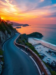 Fototapeta premium Scenic concrete road winding along Paradise Ban Krut Beach at sunset, coastal road, sea