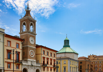 Obraz premium Clock Tower and Church of San Francesco Dome in Piazza Tre Martiri Rimini
