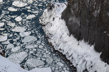 Drift ice patterns and frozen cliff at the base of Furepe Waterfall in Shiretoko, Hokkaido / 知床フレペの滝下の流氷と凍結した断崖 © warapin