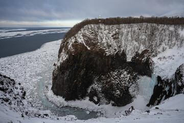 Furepe Waterfall and drift ice coastline with lighthouse in Shiretoko, Hokkaido / 知床のフレペの滝と流氷の海岸線と灯台 © warapin