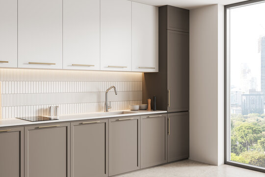 Modern minimalist kitchen interior with light cabinets, sleek fixtures, tiled backsplash and large window city view creating contemporary ambiance. 3D Rendering