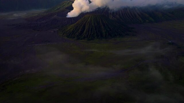 Java Island Indonesia Stunning Sunrise Drone Shot of Mount Bromo Above the Clouds