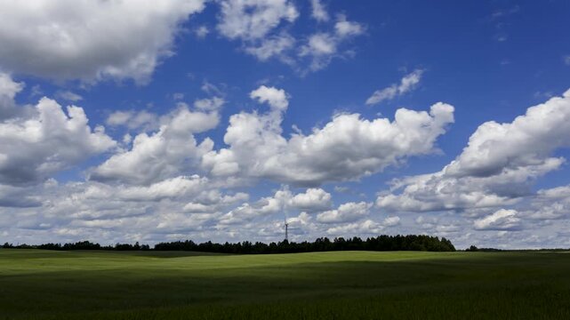 Landscape with fast moving cumulus clouds