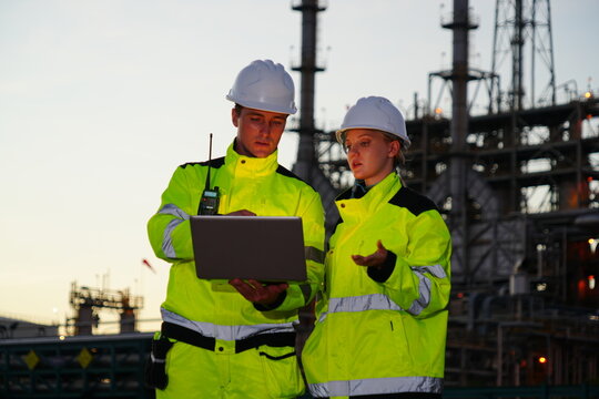The team of consultants consists of male foremen, and female engineers, wearing jackets and safety helmets, and working as inspectors and consultants, performing part-time maintenance 