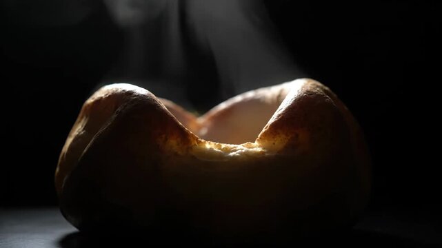 Artistic low-light yorkshire pudding golden crispy british pastry