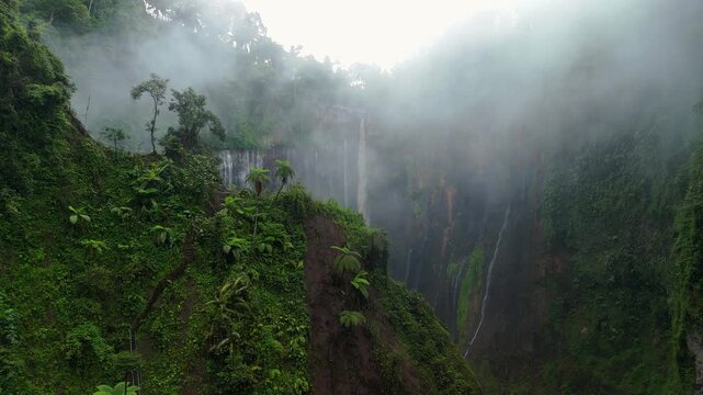Java Island Indonesia Breathtaking View of Tumpak Sewu Waterfall and Misty Valley