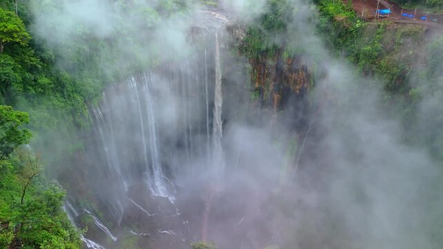 Drone Footage of Tumpak Sewu Waterfall and Rolling Clouds &ndash; Java Island Indonesia