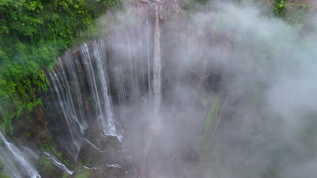 Java Island Indonesia Stunning Cloudscape Over Tumpak Sewu Waterfall and Rainforest Canyon