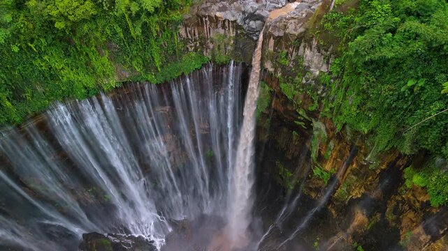 Java Island Indonesia Majestic Aerial Landscape Featuring Tumpak Sewu Waterfall and Fog